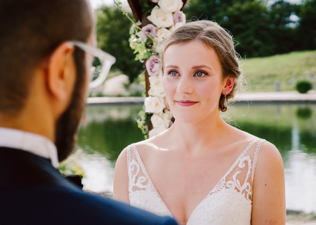 Bride looking into the groom's eyes during the wedding ceremony